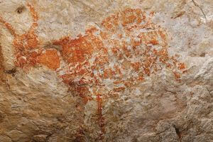 Paleolithic cave painting from East Kalimantan, Indonesia. One of the oldest known figurative paintings